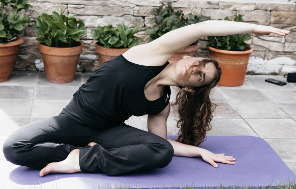 istock Fitness Enthusiast Performing Side Stretch in Outdoor Setting 2150643978
