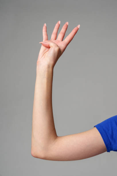istock Female hand sign against gray background in studio 2150644235