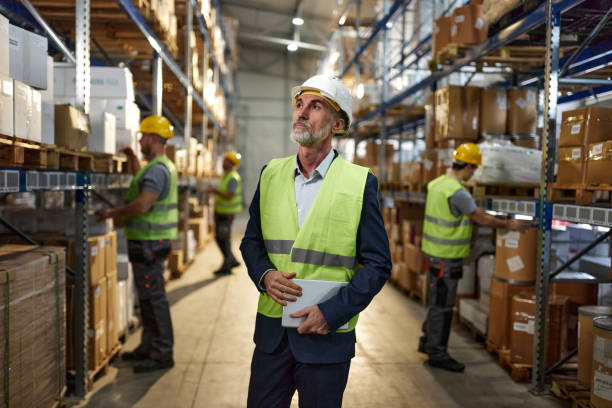 istock Mature male manager brainstorming in storage room. 2150644283