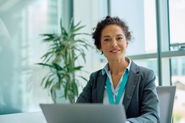 istock Happy financial advisor using laptop while working in her office and looking at camera. 2150644841