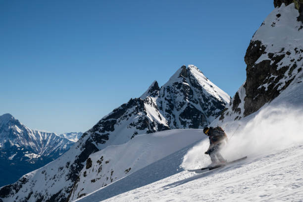 istock Ski mountaineer descends mountain slope 2150645228