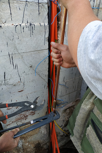The process of grounding electrical installations and devices, mounting a copper tube.new