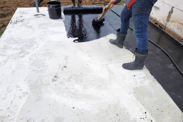 istock Masters perform work on the waterproofing of concrete in the open air. 2150645430