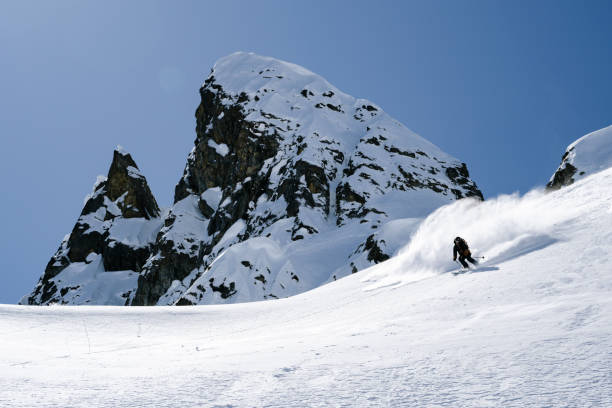 istock Ski mountaineer descends mountain slope 2150646032