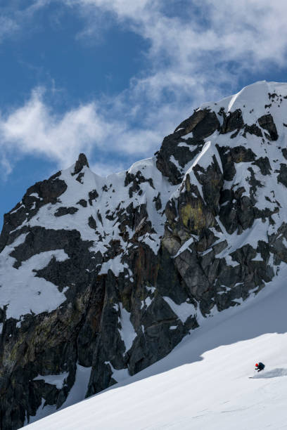 istock Ski mountaineer descends mountain slope 2150646155