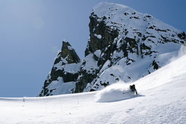 istock Ski mountaineer descends mountain slope 2150646255