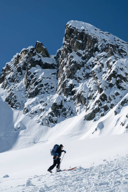 istock Ski mountaineer ascends mountain 2150646339