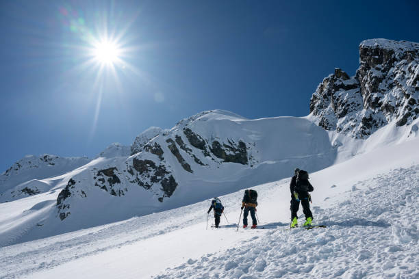 istock Ski mountaineers climb mountain 2150646343
