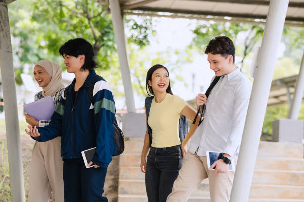 istock Group Of Asian Students Walking In School Corridor. 2150648044