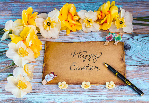 istock Easter card with yellow and white daffodils flowers, kraft paper sheet, Easter decor 2150649092