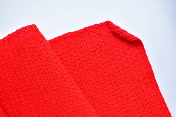 wavy of red wool knitted yarn texture, woolen fabric on white background