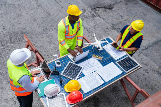 Free Stock Photo of Engineers consult on solar panel installation ...