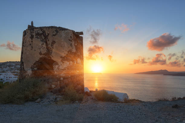 istock Fantastic view of Santorini sunset, scenic seascape with white architecture, cliffs, colored sky and sun over the Aegean sea, Greece. Outdoor travel background 2150654010