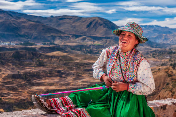 istock Peruvian woman weaving near Colca Canyon, Peru 2150656098