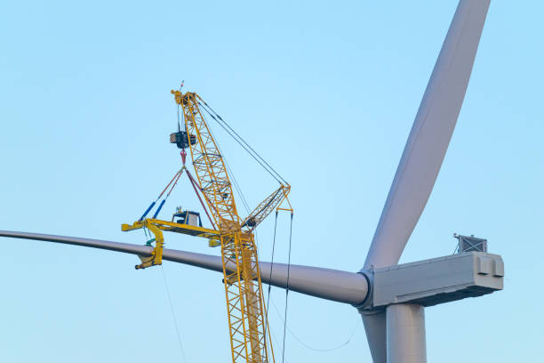 istock Wind turbine construction with huge cranes at a new wind park 2150657159