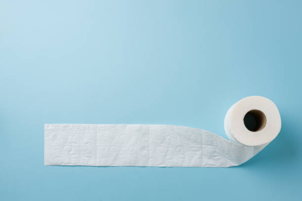 istock Top view of toilet paper roll on blue background 2150657298