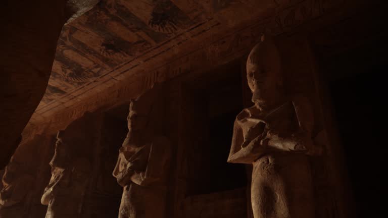 4K Video of Female in walking in to incredible Abu Simbel Temple rebuilt on the mountain in southern Egypt in Nubia next to Lake Nasser Egypt, Aswan, Abu Simbel
