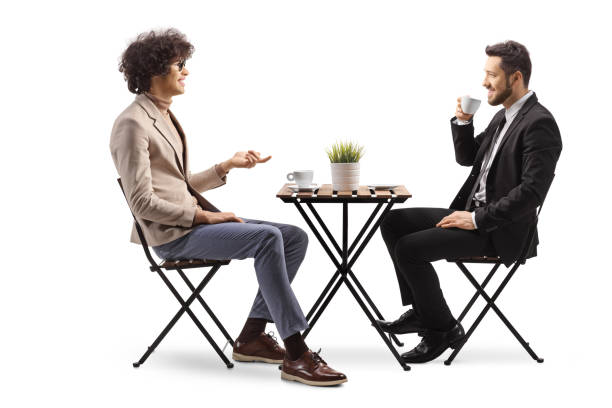 istock Professional men sitting in a cafe and having a conversation 2150659219