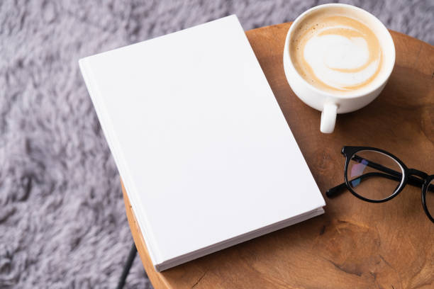 istock blank book mockup on coffee table with decorations and grey rug 2150660957