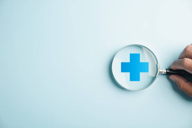 istock magnifying glass work on plus symbol and healthcare icon 2150661047