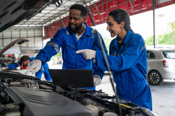 istock Team Auto mechanic in blue uniform are repair and maintenance auto engine. 2150661637