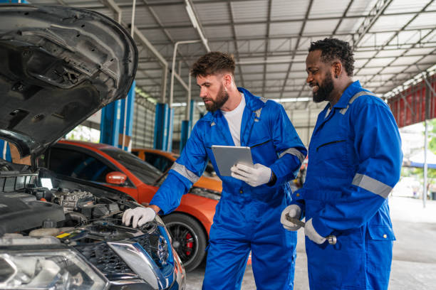 istock Team Auto mechanic in blue uniform are repair and maintenance auto engine. 2150661691
