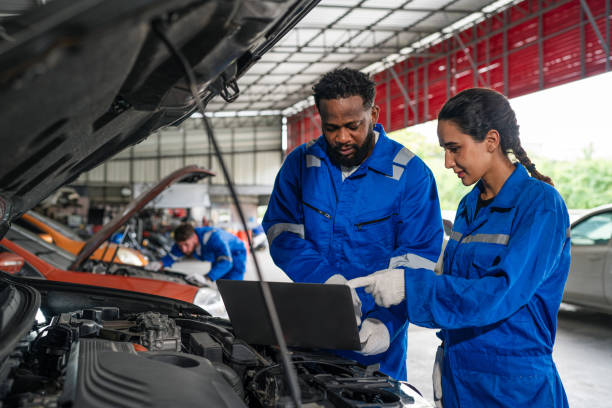 istock Team Auto mechanic in blue uniform are repair and maintenance auto engine. 2150661772