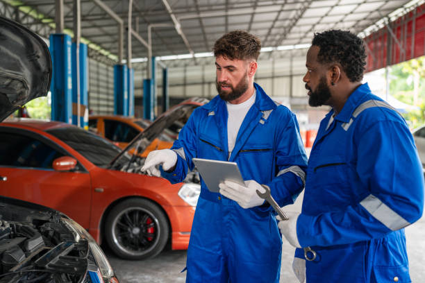 istock Team Auto mechanic in blue uniform are repair and maintenance auto engine. 2150661907