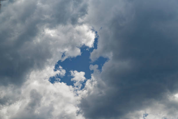istock A gap in the clouds through which the blue sky is visible 2150662020