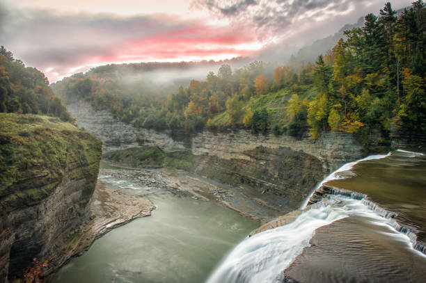 istock Sunrise over letchworth state park canyon and waterfall 2150663393
