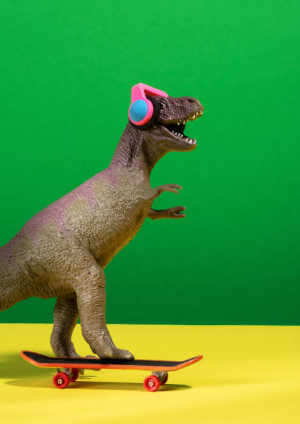 istock Cute dinosaur skates and listens music 2150663799