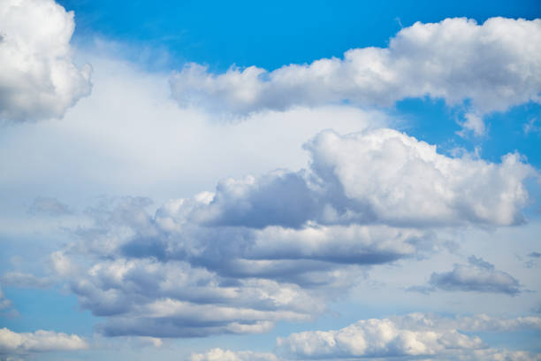 istock White clouds in the blue sky, sunlight on white clouds in the sky, sky landscape with white clouds 2150664104