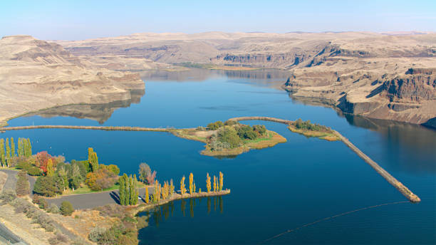 Aerial view of Snake River flowing amidst rocky mountains in autumn, Washington State, USA.