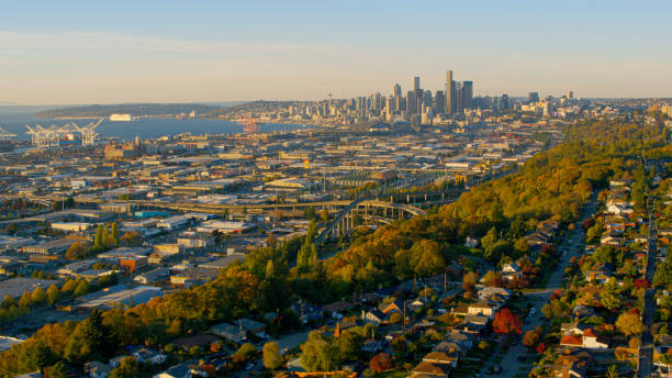 Aerial view of cityscape with South Seattle downtown at a distance during sunset, Seattle, Washington State, USA.