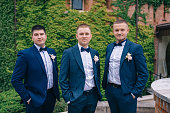 The groom and friends in blue suits