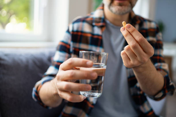 istock Man medicating himself at home 2150667180