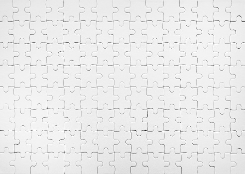 Blank white jigsaw puzzle pattern as mockup background, top view