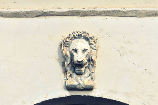 Lion head concrete mold cast ornament above the building entrance