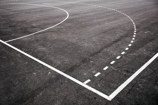Outdoor handball and futsal court with asphalt flooring, selective focus