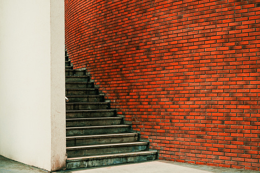 Urban staircase with modern brick wall pattern, selective focus