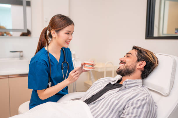 istock Professional young female dentist latex gloves examining teeth. 2150672194