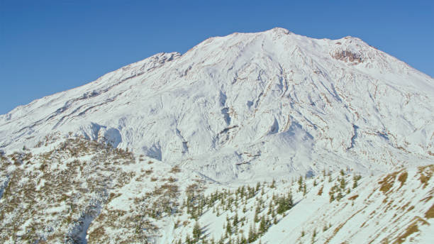 Aerial view of Mount St. Helens against blue sky, Skamania County, Washington State, USA.