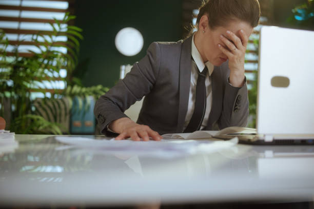 istock unhappy woman worker in green office throwing documents 2150675832
