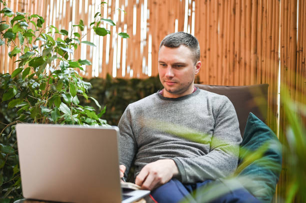 istock Man filling to do list. 2150676532