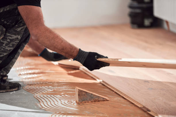 istock Professional handyman installing laminate flooring in a new apartment. 2150678784