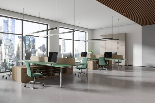 istock Modern business interior with pc monitors on desk, shelf near panoramic window 2150678969
