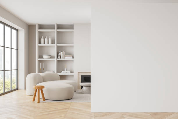 istock Stylish living room interior with couch and fireplace, window. Mockup empty wall 2150679743