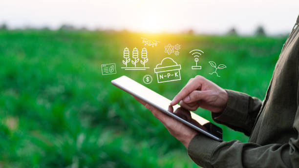 istock Farmers use agricultural technology in data analysis tablets and image icons. New technologies in agricultural business concepts. Men use tablets to research and develop plant varieties, agricultural technology 2150680857