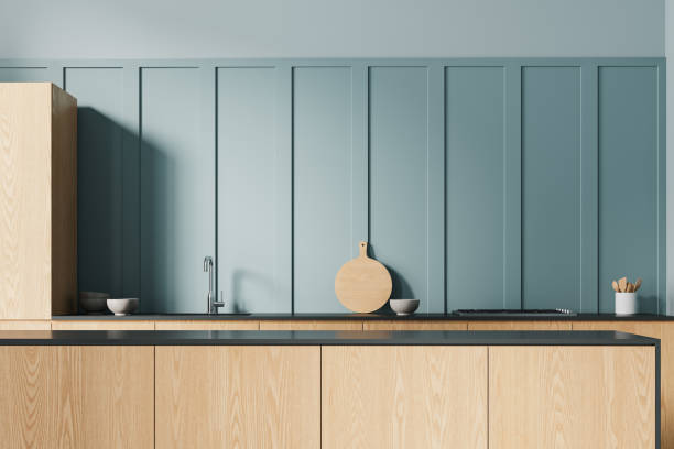 istock Modern home kitchen interior with bar island, sink and stove with kitchenware 2150681058