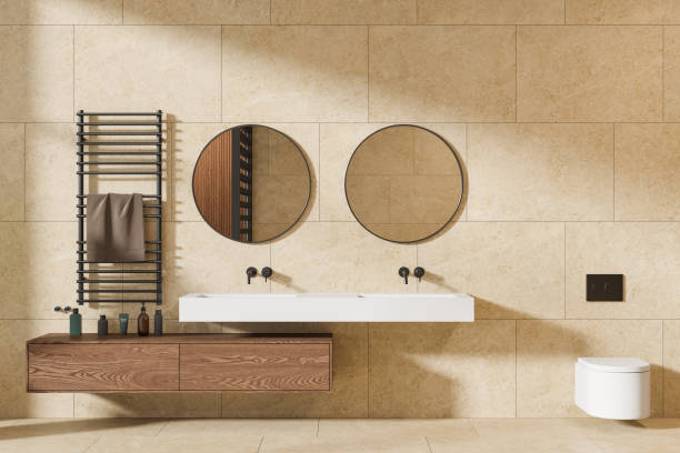 istock Yellow bathroom interior with double sink and toilet 2150681066